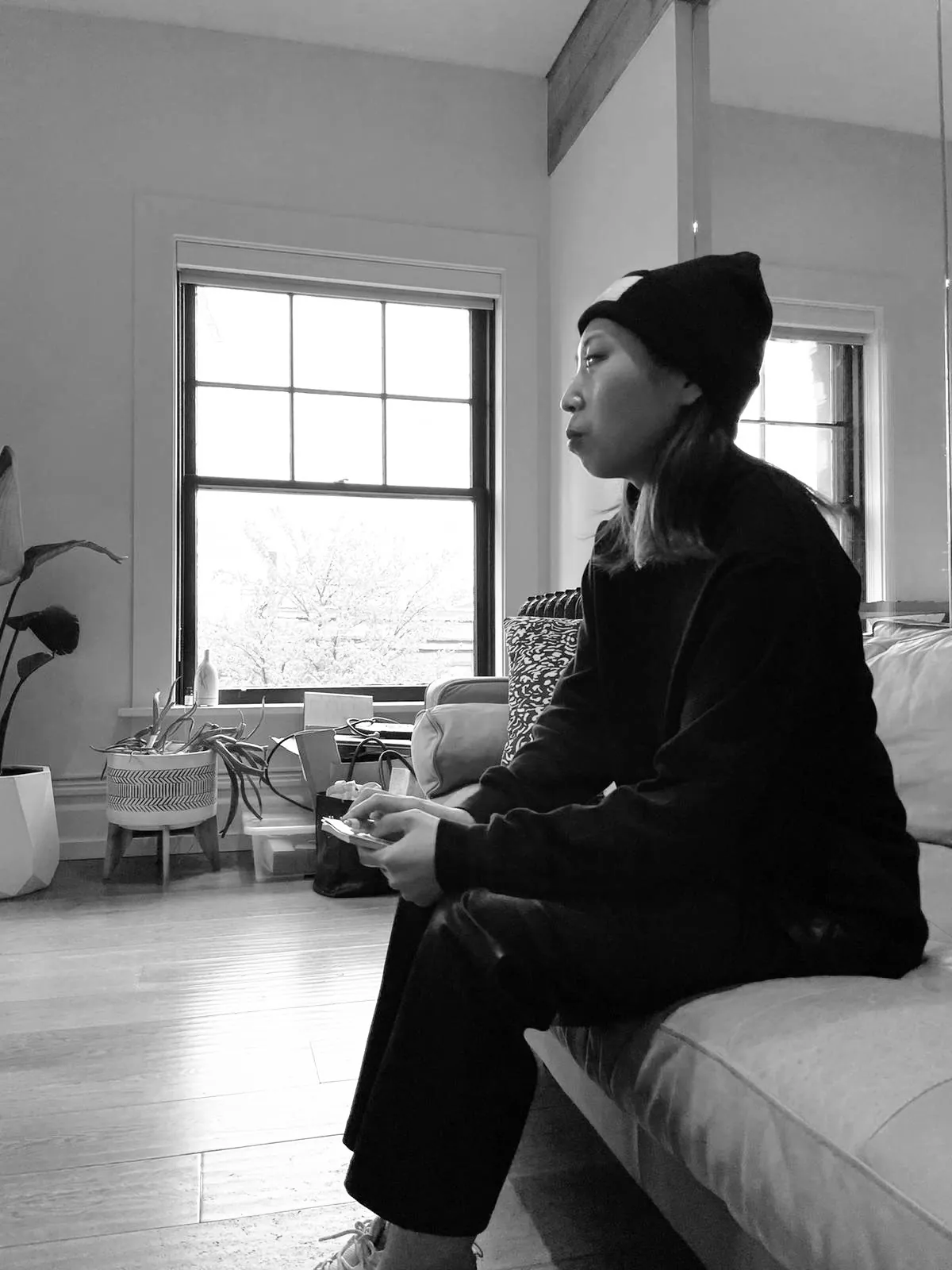 A pause on the couch by the studio windows