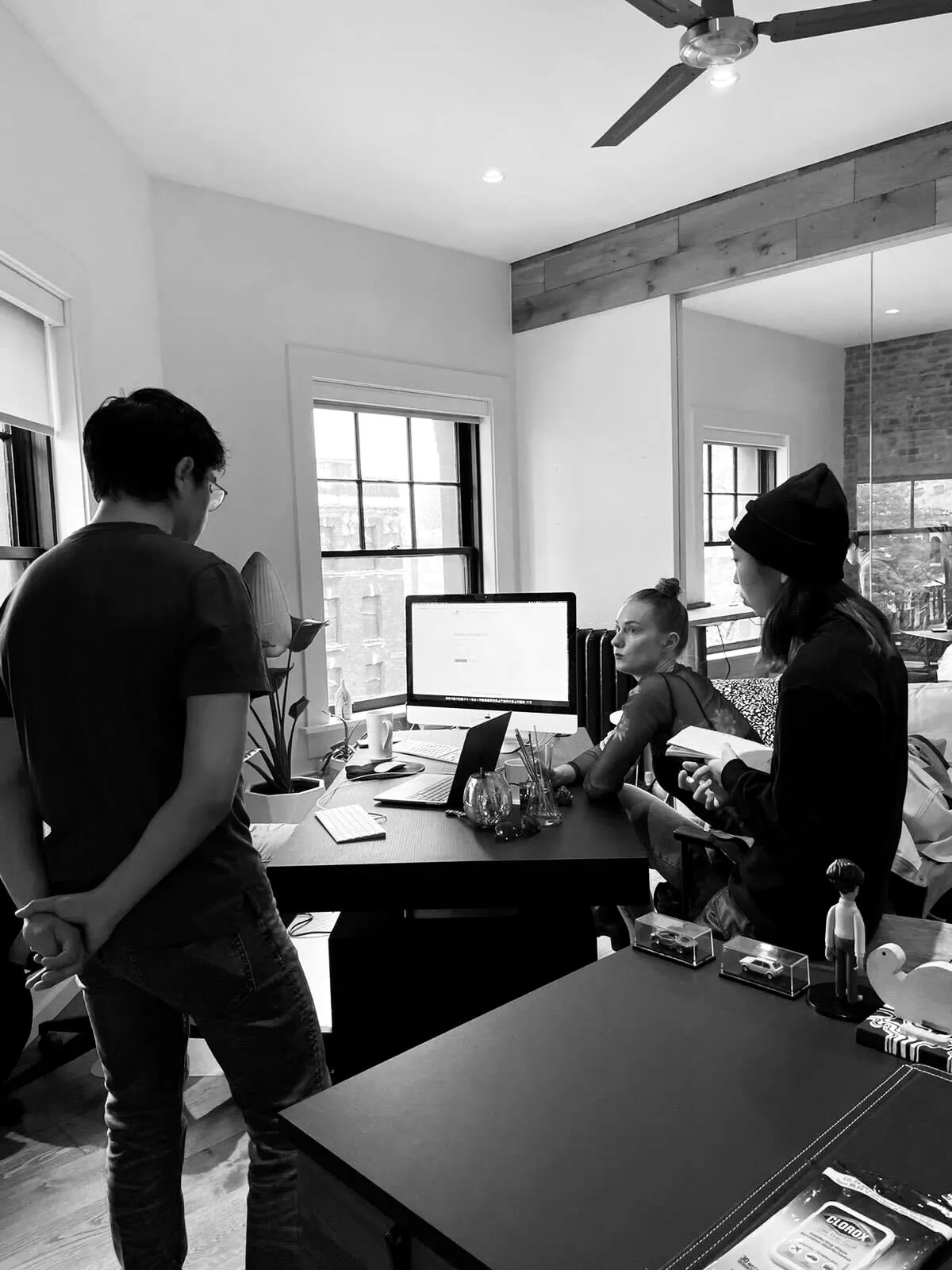Reviewing work together at the iMac