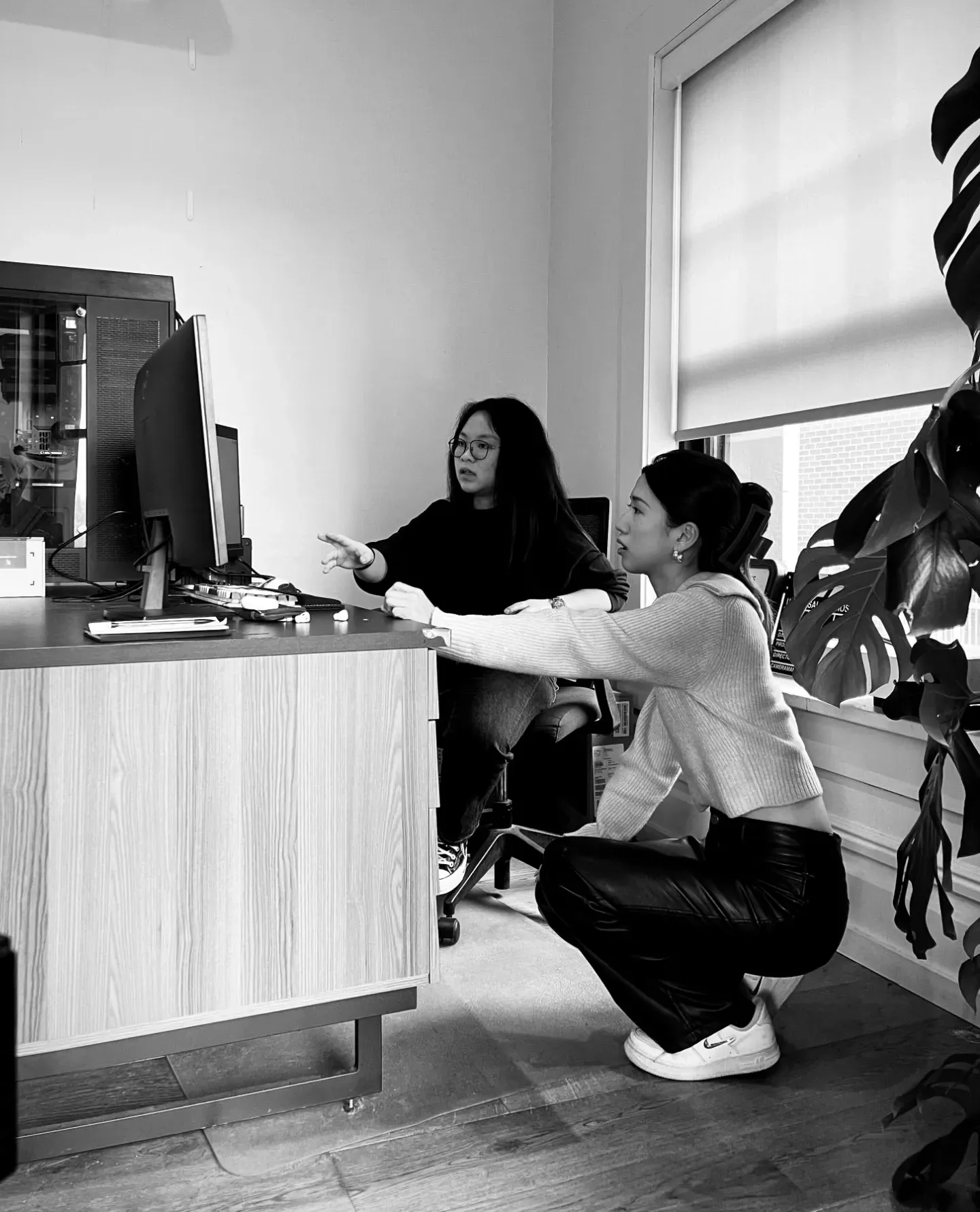 Talking through work at the monitor