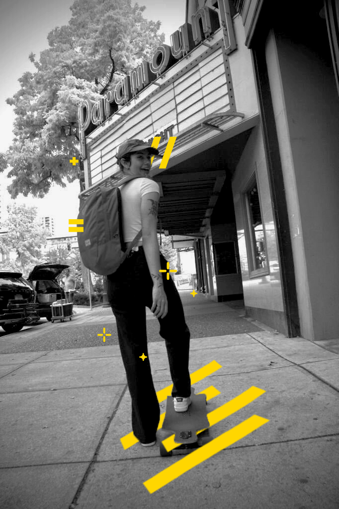 Alanesna Alves has one foot on the skateboard.